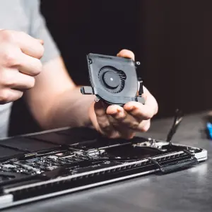 Dust buildup inside a laptop cooling fan